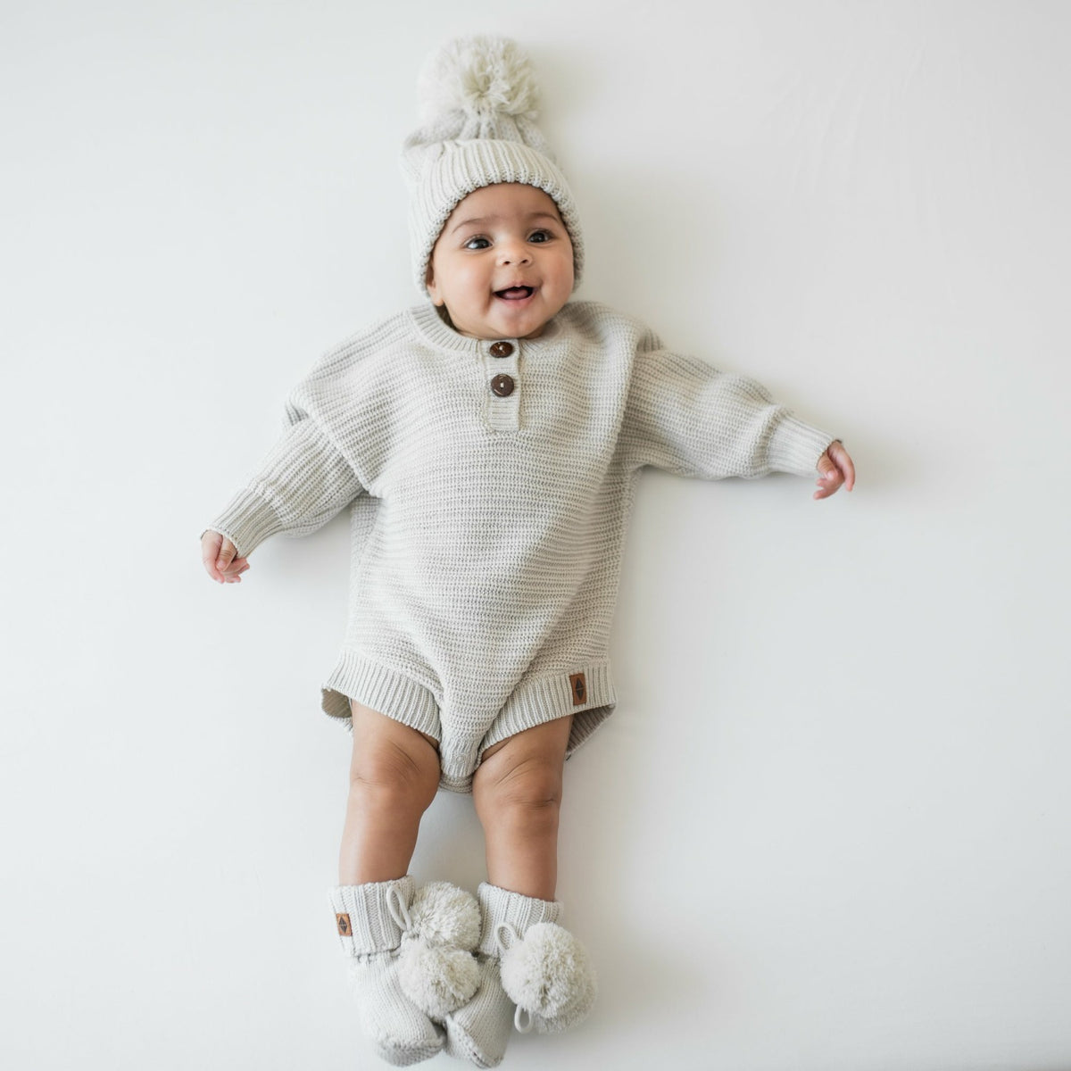 Chunky Cable Knit Beanie in Oat | Kyte Baby
