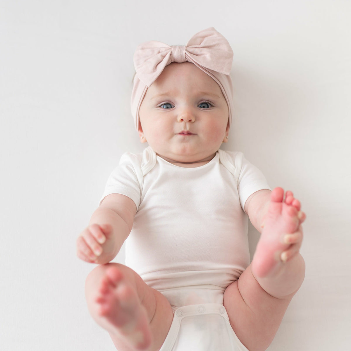 Bow Headband in Blush | Kyte Baby