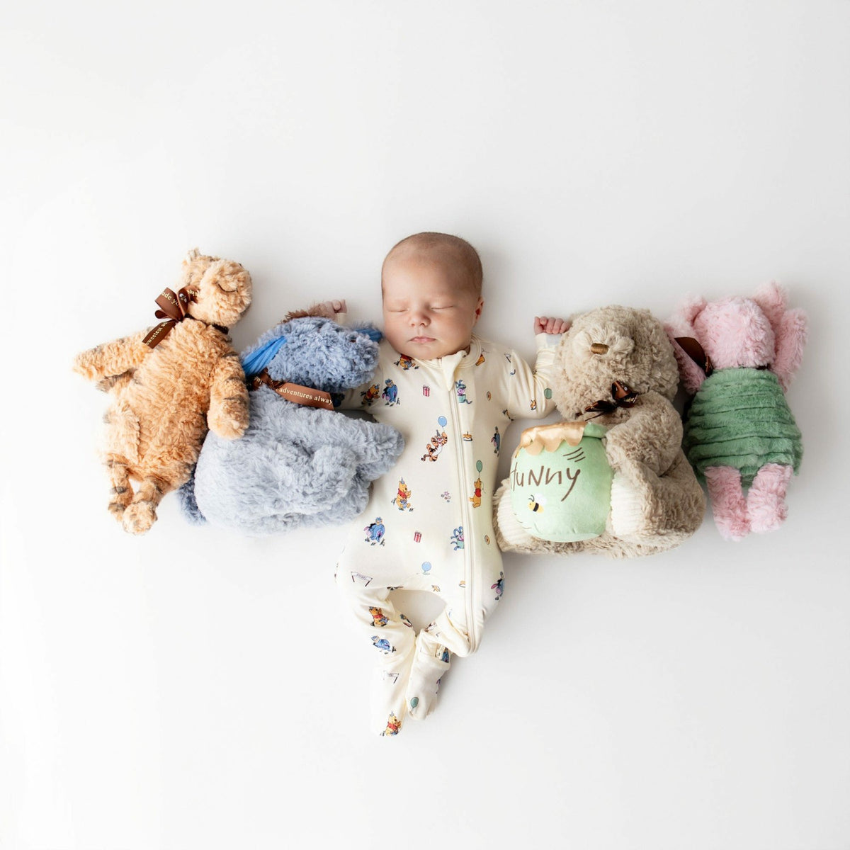 Zippered Footie in Winnie the Pooh Celebration | Kyte Baby