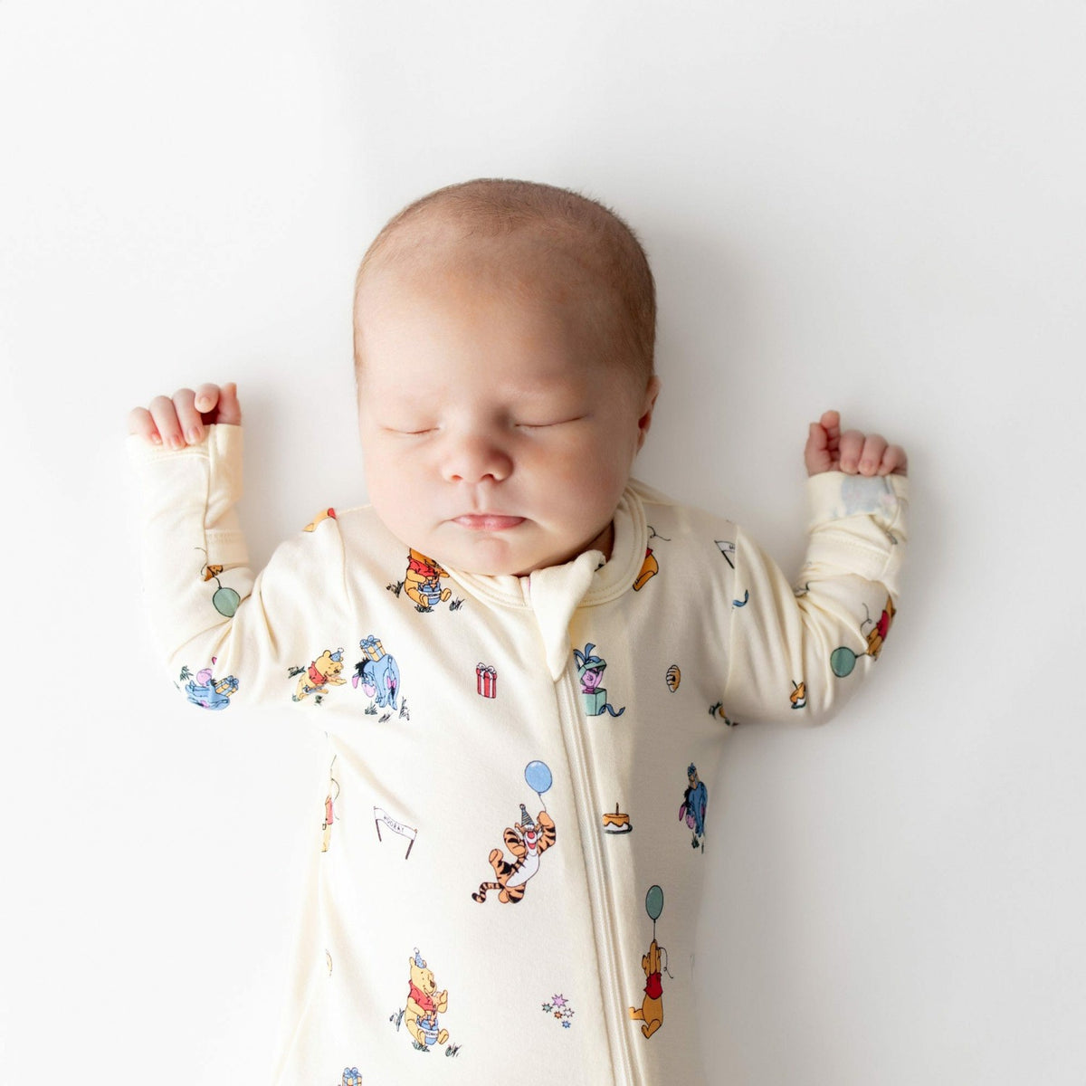 Zippered Footie in Winnie the Pooh Celebration | Kyte Baby