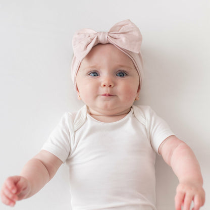 Bow Headband in Blush | Kyte Baby