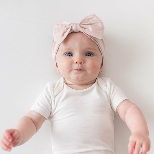 Bow Headband in Blush | Kyte Baby