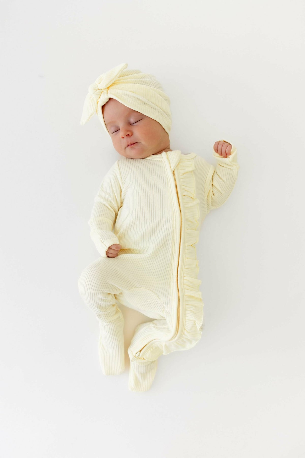 Ribbed Ruffle Zipper Footie in Chamomile | Kyte Baby