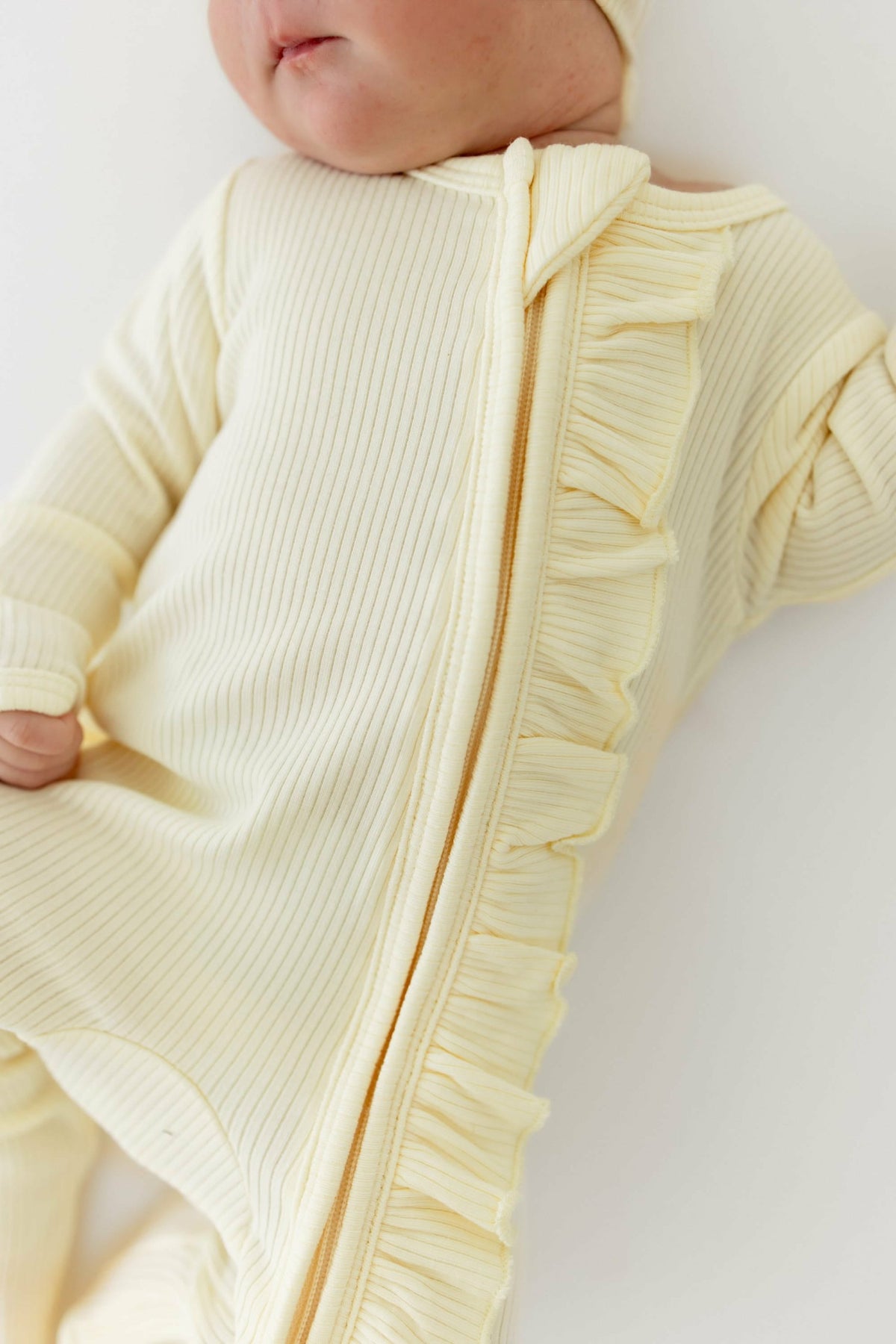 Ribbed Ruffle Zipper Footie in Chamomile | Kyte Baby