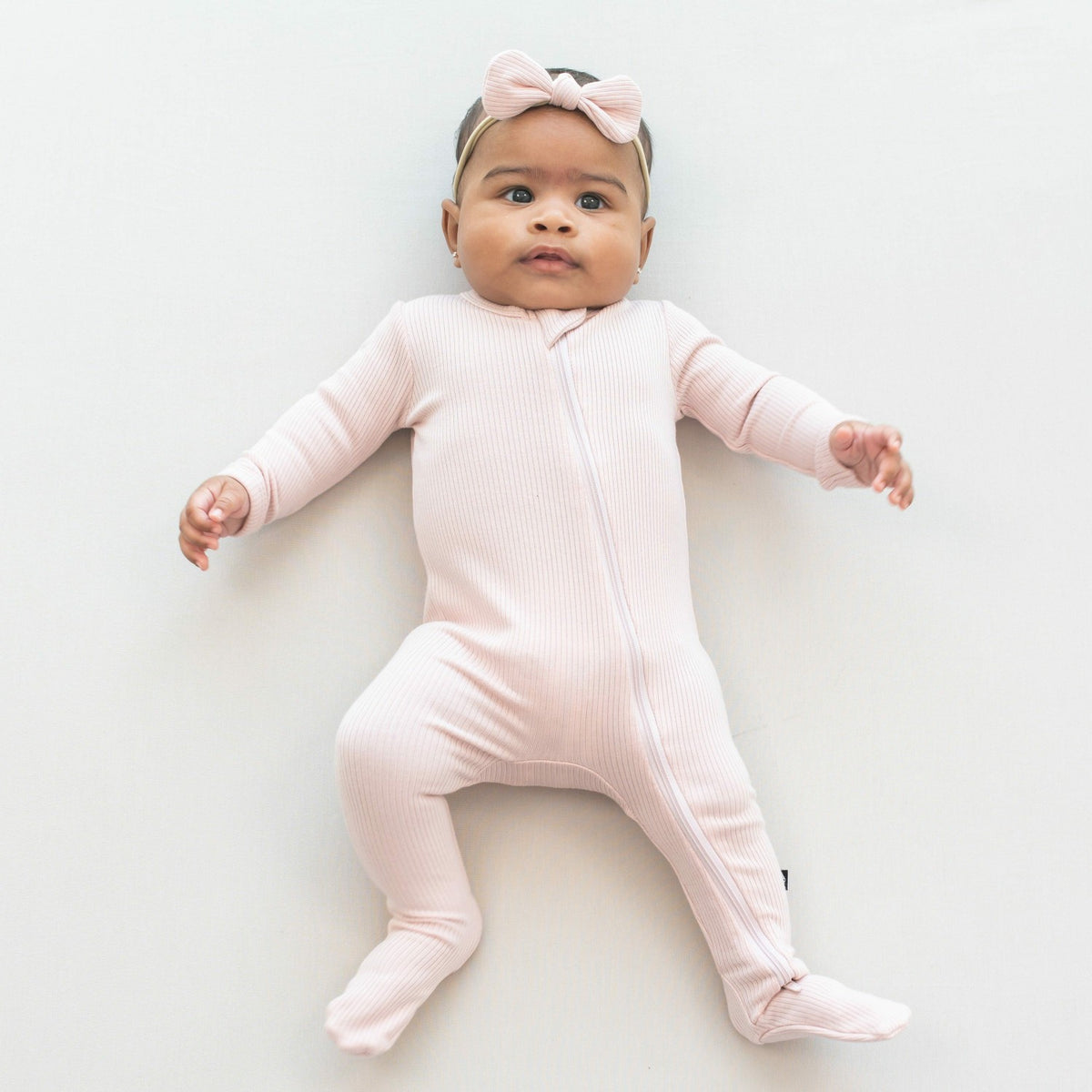 Ribbed Zipper Footie in Blush | Kyte Baby