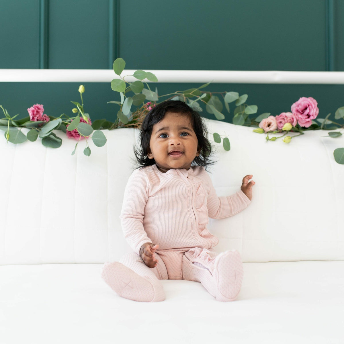 Ribbed Ruffle Bamboo Zipper Footie in Blush | Kyte Baby