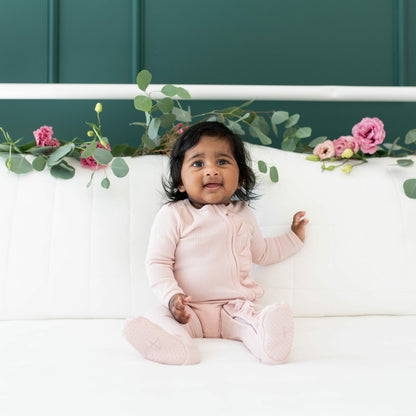 Ribbed Ruffle Bamboo Zipper Footie in Blush | Kyte Baby