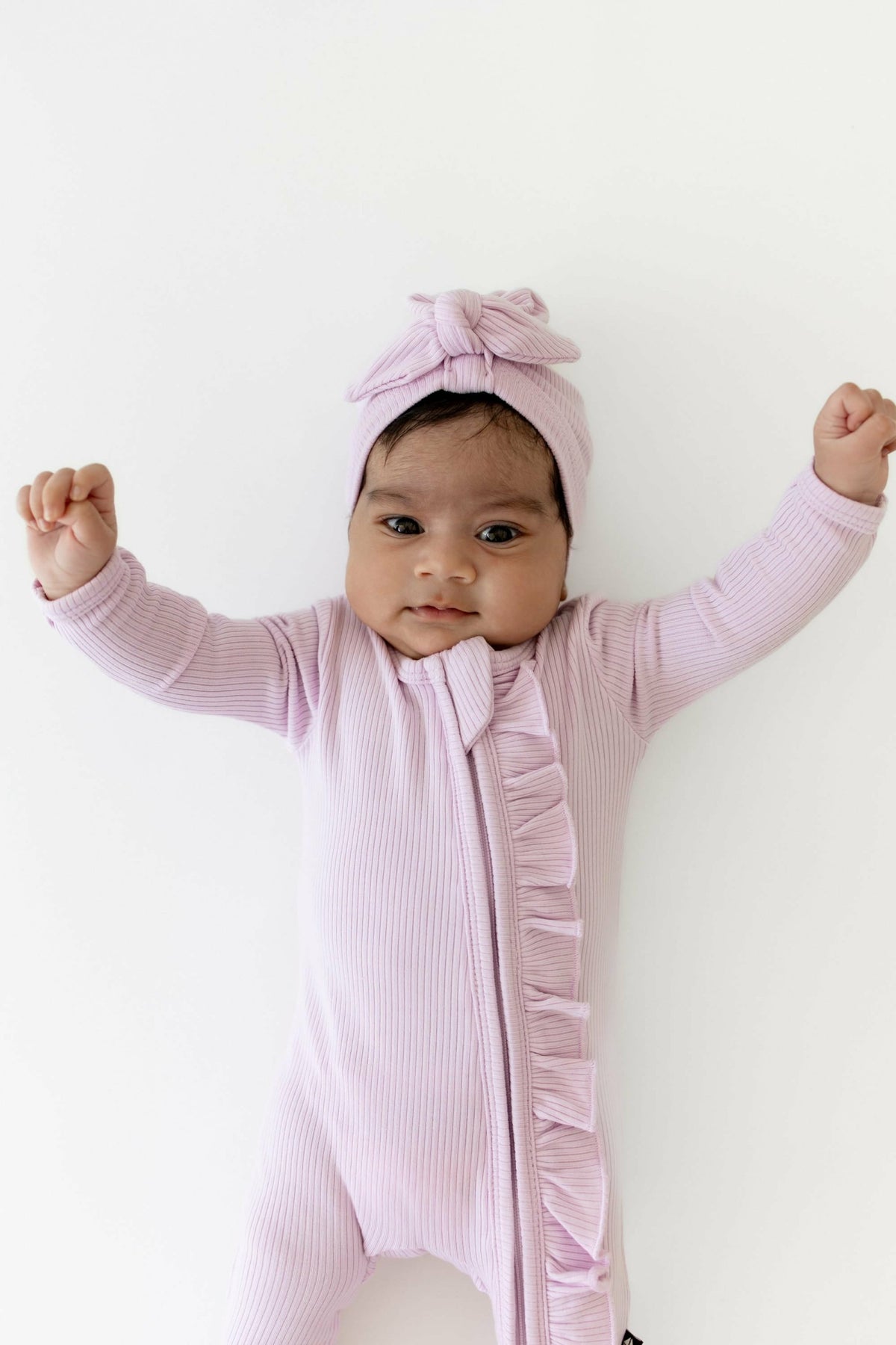 Ribbed Ruffle Zipper Footie in Thistle | Kyte Baby