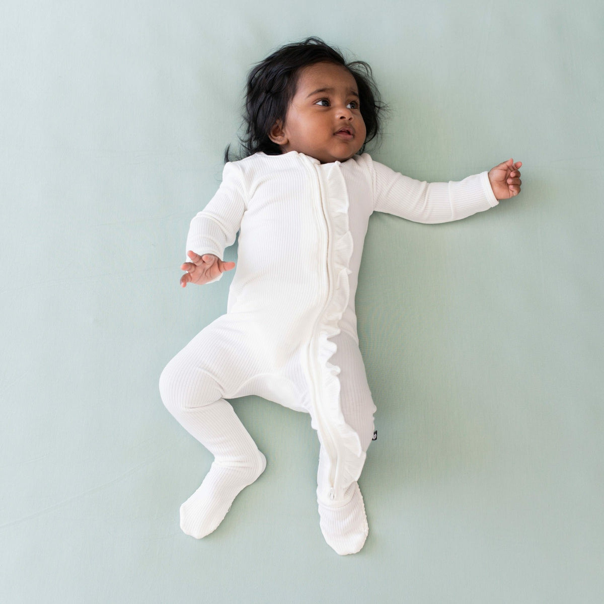 Ribbed Ruffle Zipper Footie in Cloud | Kyte Baby