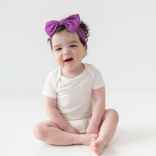 Bow Headband in Berry | Kyte Baby