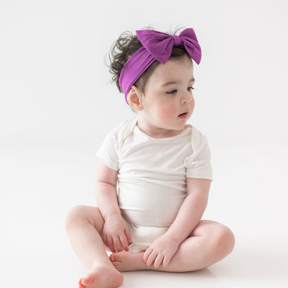 Bow Headband in Berry | Kyte Baby
