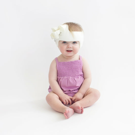 Smocked Bubble Romper in Poi | Kyte Baby