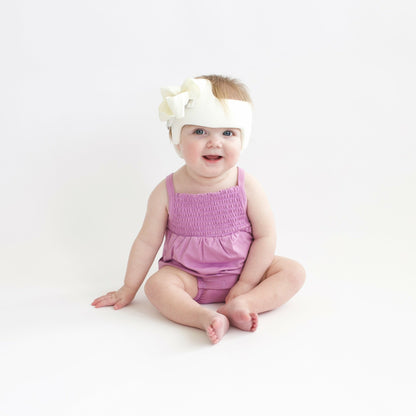 Smocked Bubble Romper in Poi | Kyte Baby