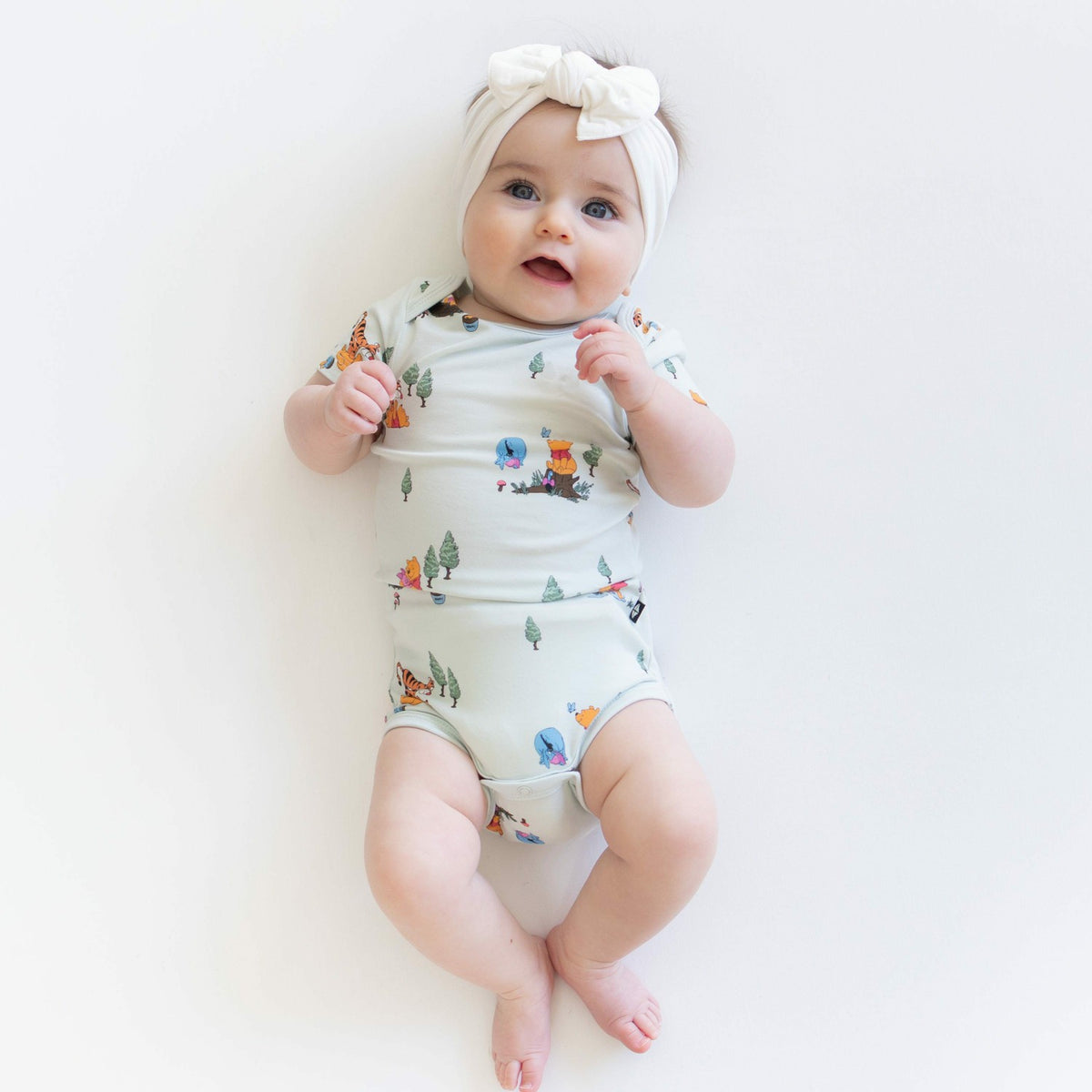 Bodysuit in Winnie the Pooh Hundred Acre Wood | Kyte Baby