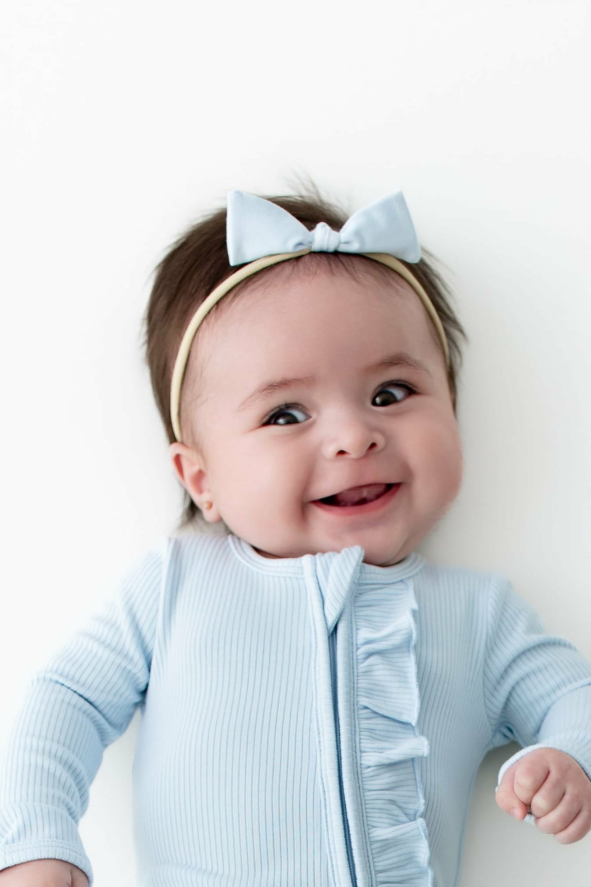 Ribbed Ruffle Zipper Footie in Breeze | Kyte Baby