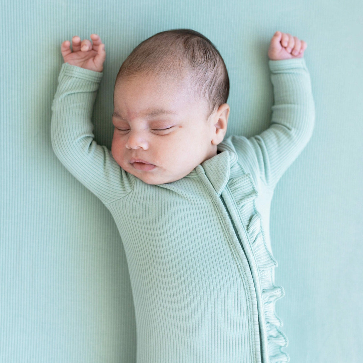 Ribbed Ruffle Zipper Footie in Sage | Kyte Baby