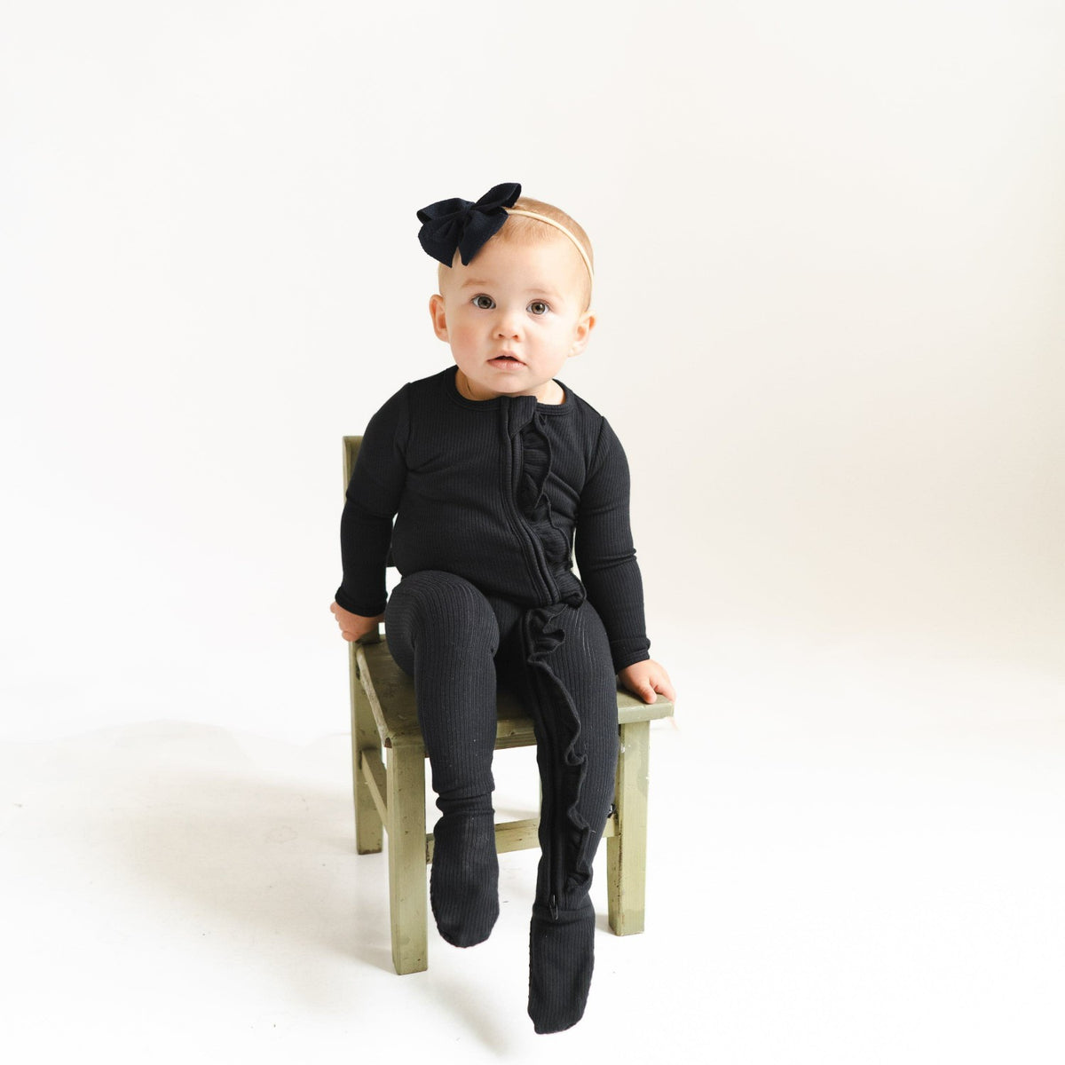 Ribbed Ruffle Zipper Footie in Midnight | Kyte Baby
