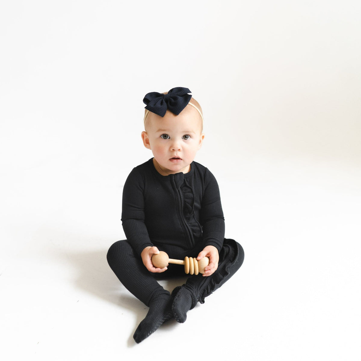 Ribbed Ruffle Zipper Footie in Midnight | Kyte Baby