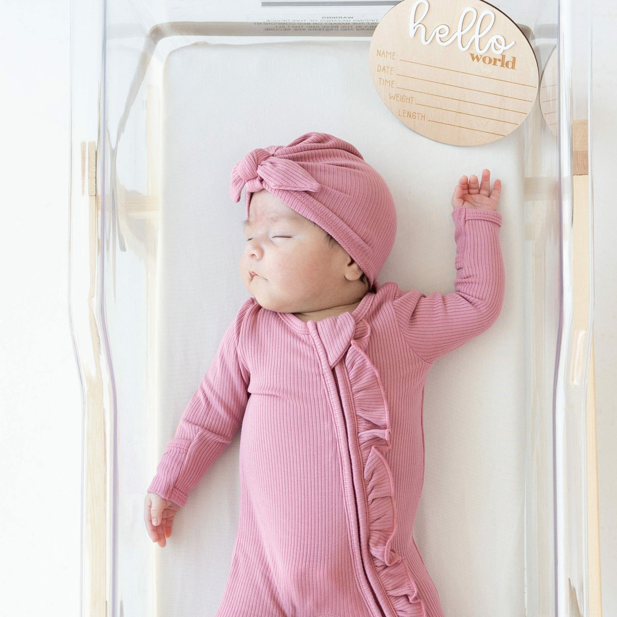 Ribbed Ruffle Zipper Footie in Apple Blossom | Kyte Baby
