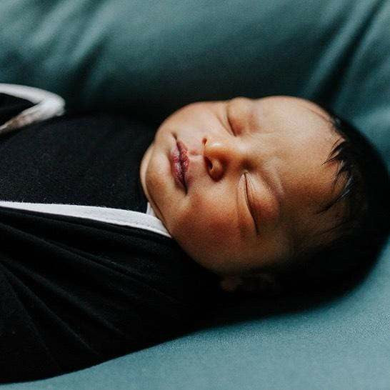 Swaddle Blanket in Midnight with Cloud Trim | Kyte Baby