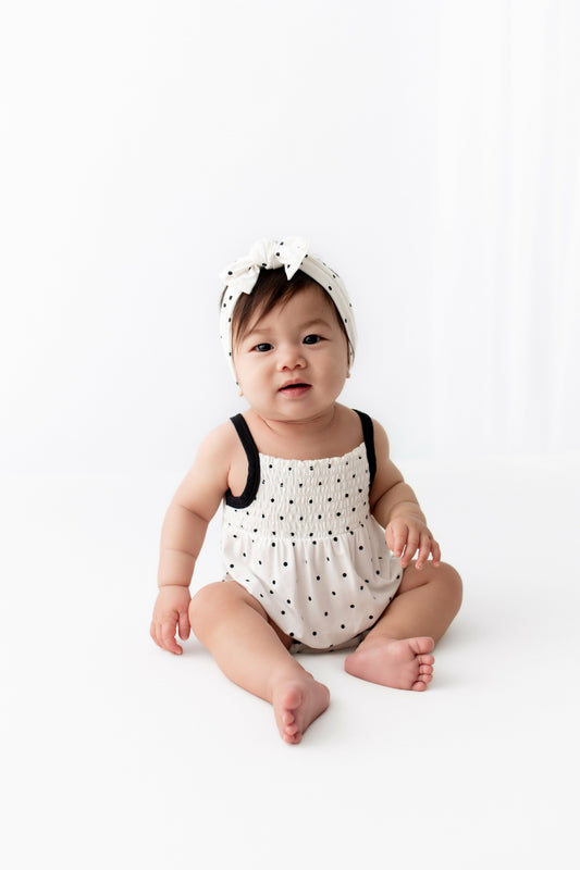 Smocked Bubble Romper in Midnight Polka Dot | Kyte Baby